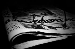 business newspaper and glasses