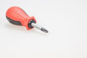 red screwdriver on a white background