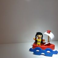 toy sailing boat with a man