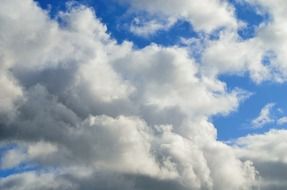 background with white clouds on the blue sky