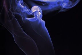 Purple smoke on black background