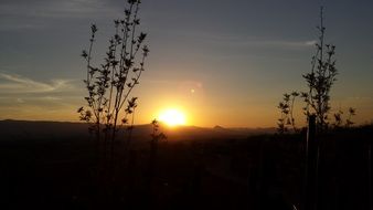 sunset silhouette red mountain sun