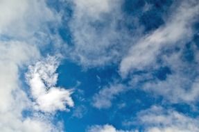 background with white clouds on the blue sunny sky