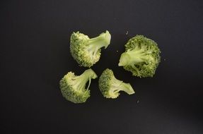 brokoli vegetables black background