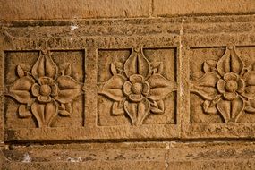carved flower pattern wood wall