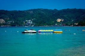 blue ocean water cliff banana-boat