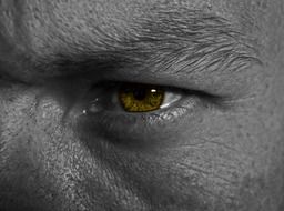 macroview of a man eye with light effect