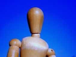 the upper part of the figure doll-woman on the sky background