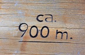 carved number on the wooden surface