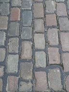 uneven stone paving on the road