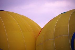 Two yellow hot air balloons