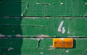 wood weathered green yellow number