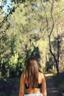 girl woman back sports bra long dark hair