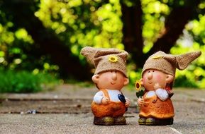 a pair of cute figurines for decorating garden