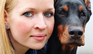 Portrait of woman and Doberman pinscher doggy