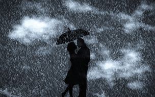 couple in love under an umbrella during the rain