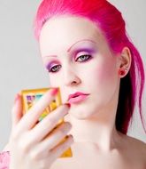 model with pink makeup and bright hair