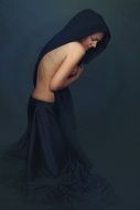 Young woman in the dark clothing