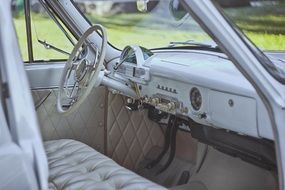 Inside of white classic automobile
