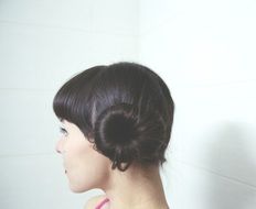 brunette with a curly haircut