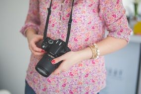 camera nikon in woman hands