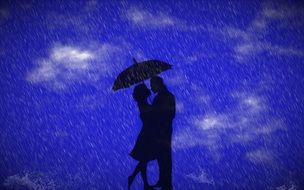 silhouettes of a couple under umbrella