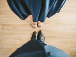 man and woman feet at floor