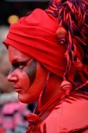woman with face paint in carnival