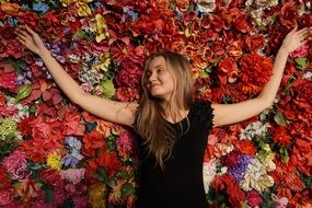 young girl on flowers bed