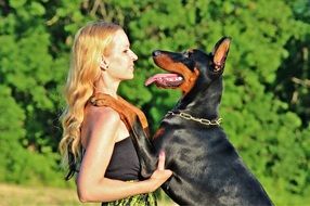 woman with doberman pinscher