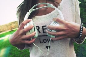 headphones in hand