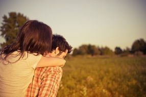 couple in love on a green field