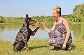 Photo of woman and Doberman pinscher