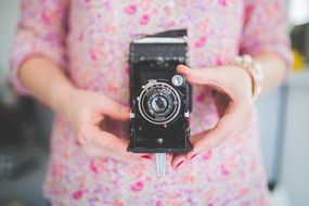 vintage camera in woman hand