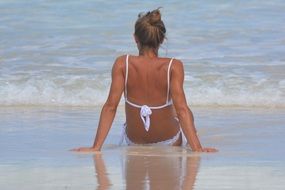 woman in white swimsuit on the beach