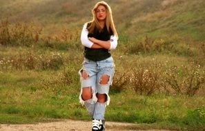 Fashion blond girl on a meadow