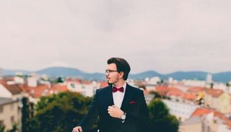 Photo of the man wearing suit and bow-tie