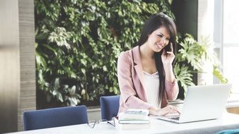 beautiful business woman at the table with laptop