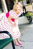 Photo of laughing vintage woman is on a street