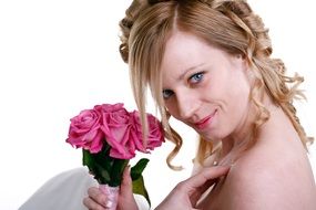 bride with a bouquet of pink roses