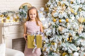 a child with a gift for Christmas