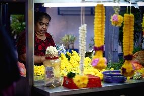 Adult Woman in flower shop decorating