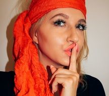 portrait of a girl with an orange scarf on her head