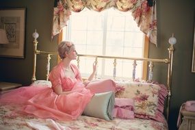 vintage retro pink woman on bed retro bedroom