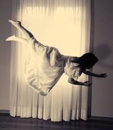 monochrome creative picture of the flying woman