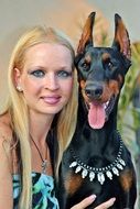 friendship between doberman and its owner