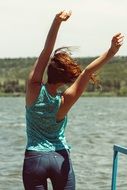 happy girl near the water on a sunny day