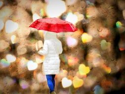 woman under red umbrella on bokeh background