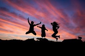 Silhouette of jumping people