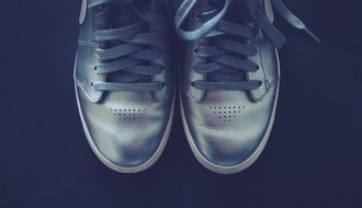 gray sneakers on a black background